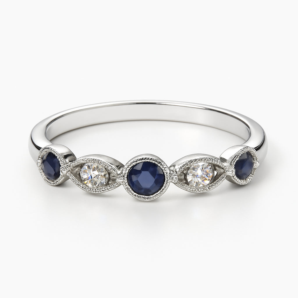 Christmas Charm: 10 Karat White Gold Round Blue Sapphire Ring (0.12 ct)
