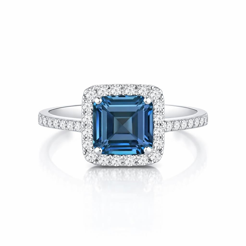 14 Karat White Gold Ring with Blue Stone
