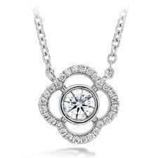Sure, how about this: 18 Karat White Gold Necklace with Signature Petal Bezel Set Natural Diamond 0.26 ct