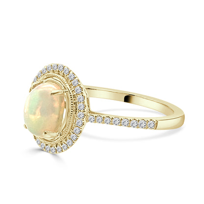 Oval Opal and Diamond Ring in 14 Karat Yellow Gold - 0.90 Carats