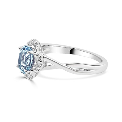 Oval Aquamarine Floral Diamond Halo Ring in 14 Karat White Gold (0.68 ct)