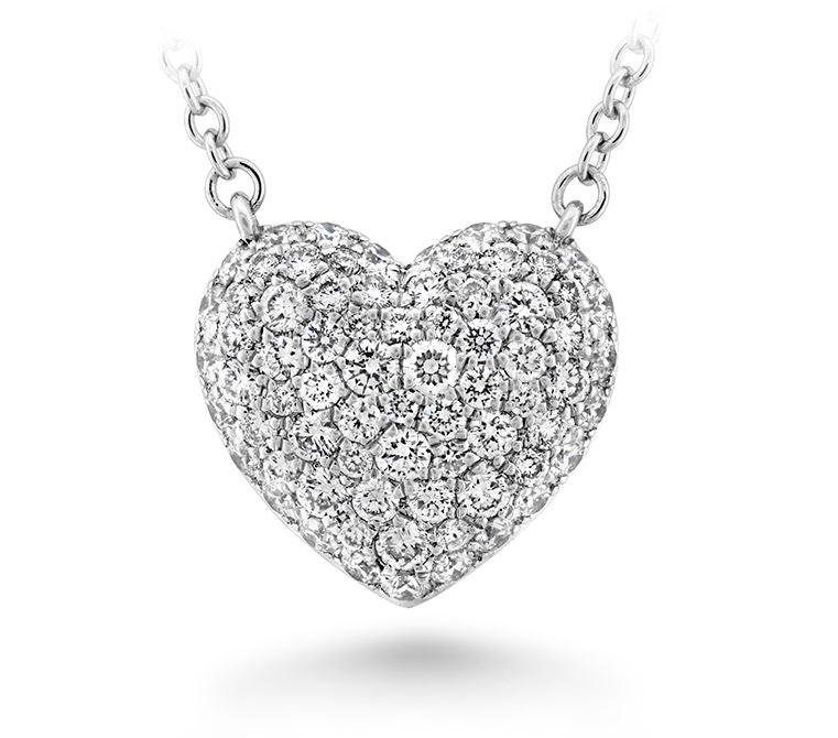 Sure! How about Elegant 18 Karat White Gold Pave Heart Necklace with 0.53 Natural Diamond?
