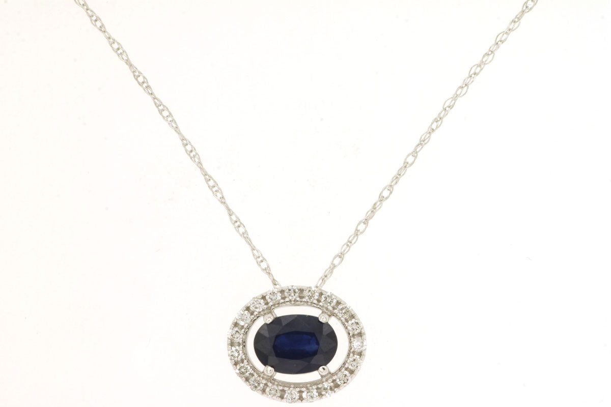 Oval Blue Sapphire Halo Necklace in 14 Karat White Gold - East To West Design (0.65 ct)